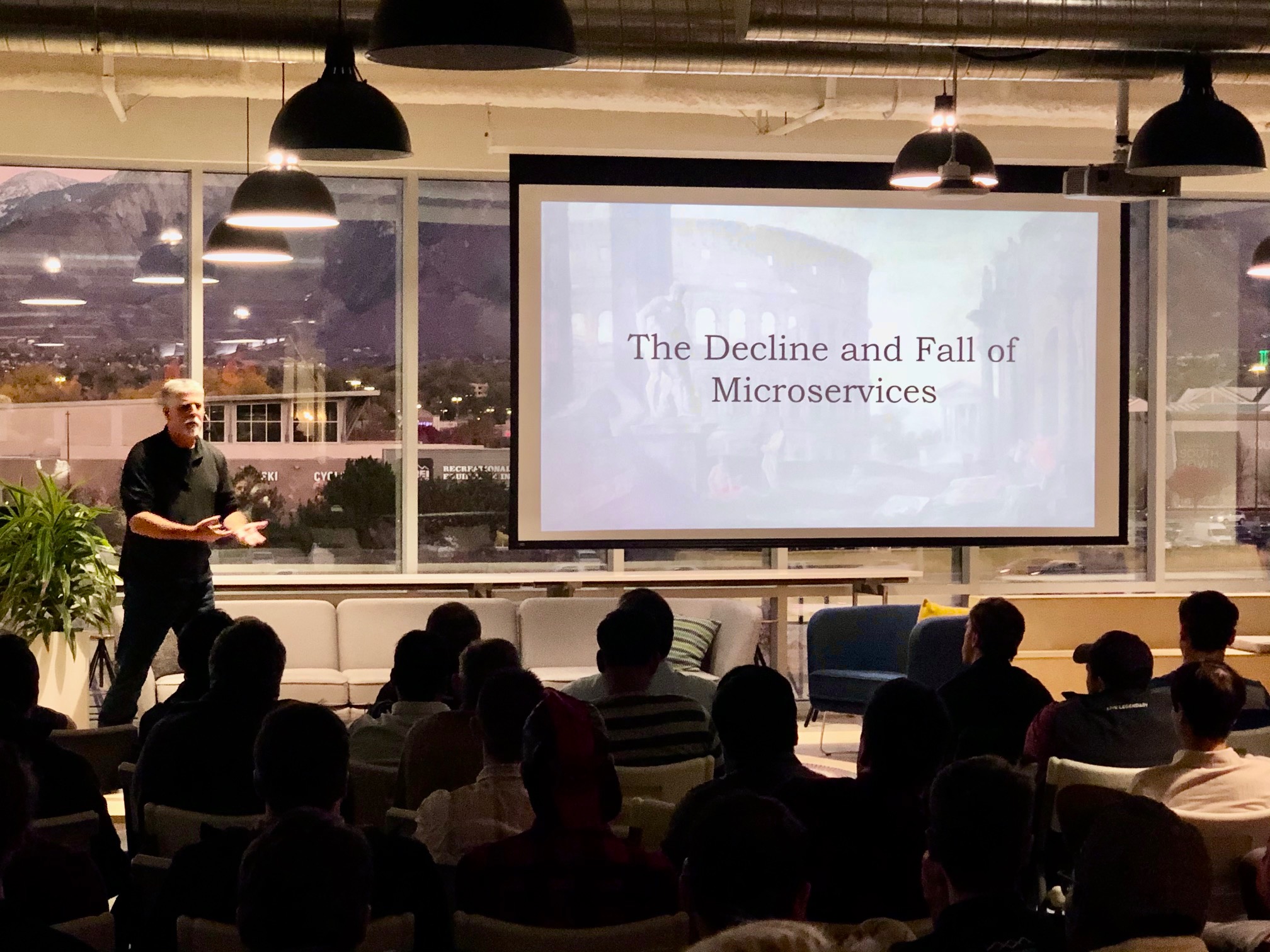 Speaker with mountains backdrop